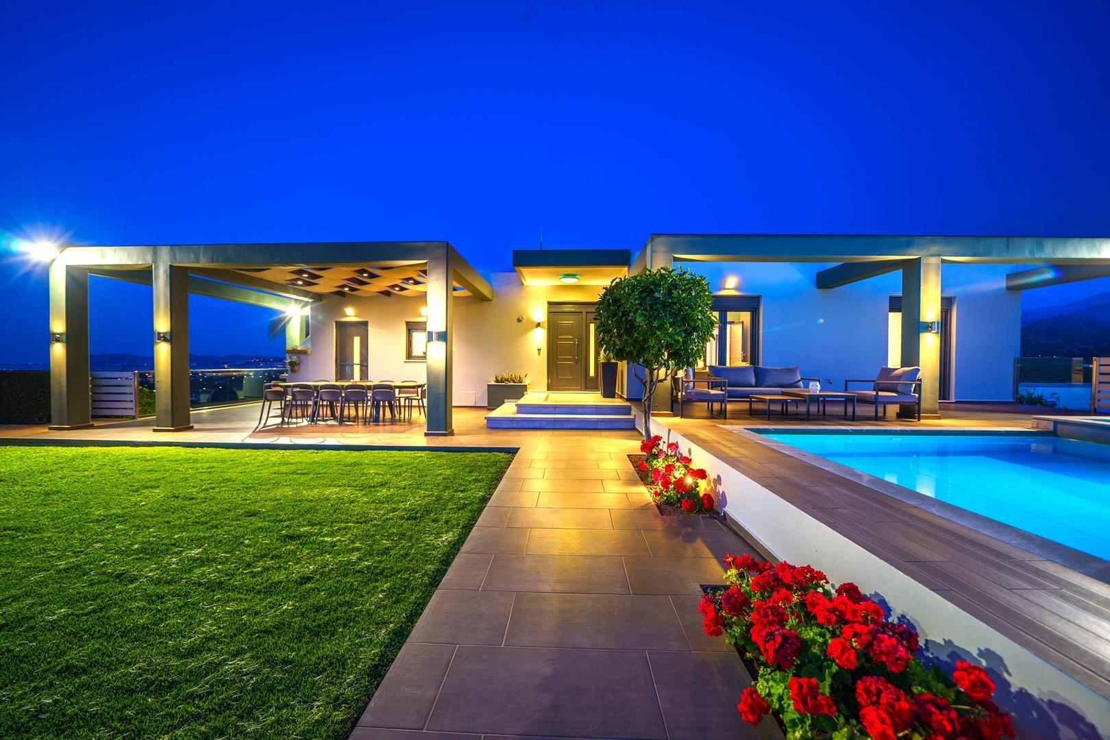 Exterior view of the luxurious villa in Chania with a heated pool and Jacuzzi bath